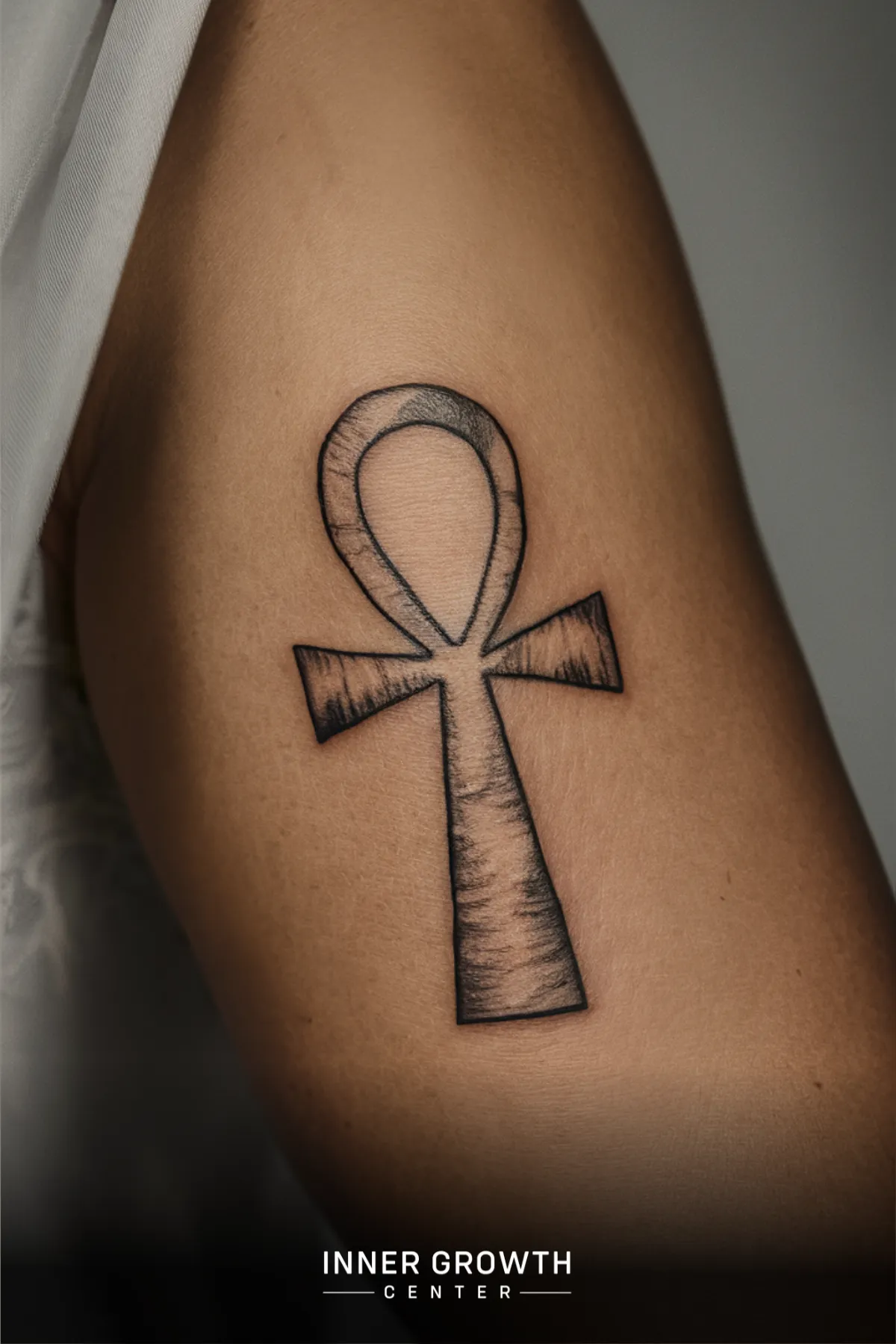 An ankh tattoo.