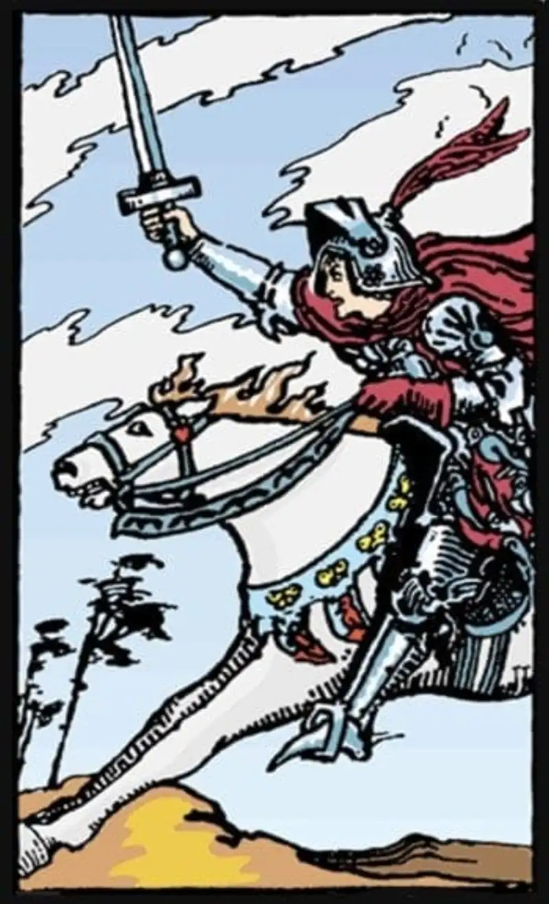 A knight on horseback charges forward with sword in hand as the knight of swords tarot card.