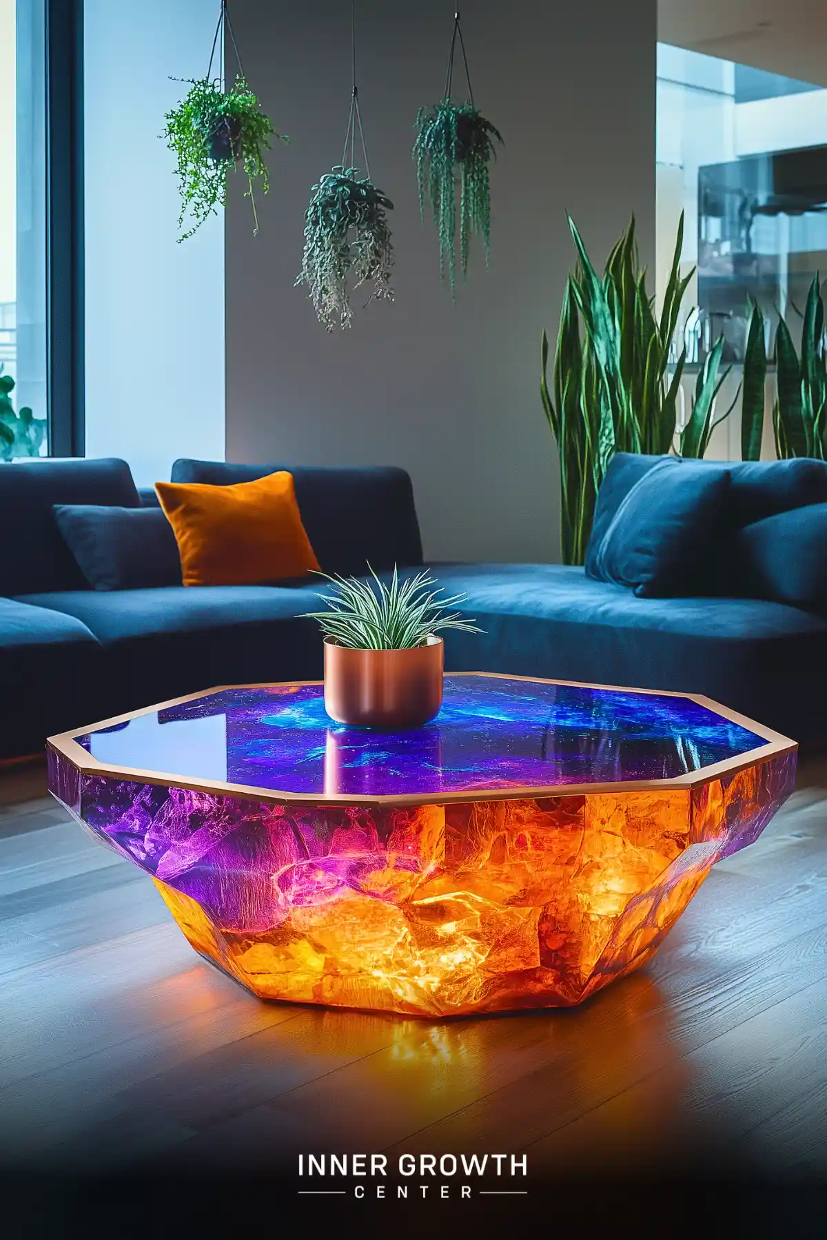 Octagonal coffee table with glowing galaxy design and hanging plants nearby