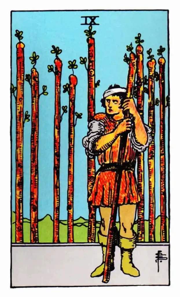 9 of wands tarot card showing an injured man and 9 wooden wands