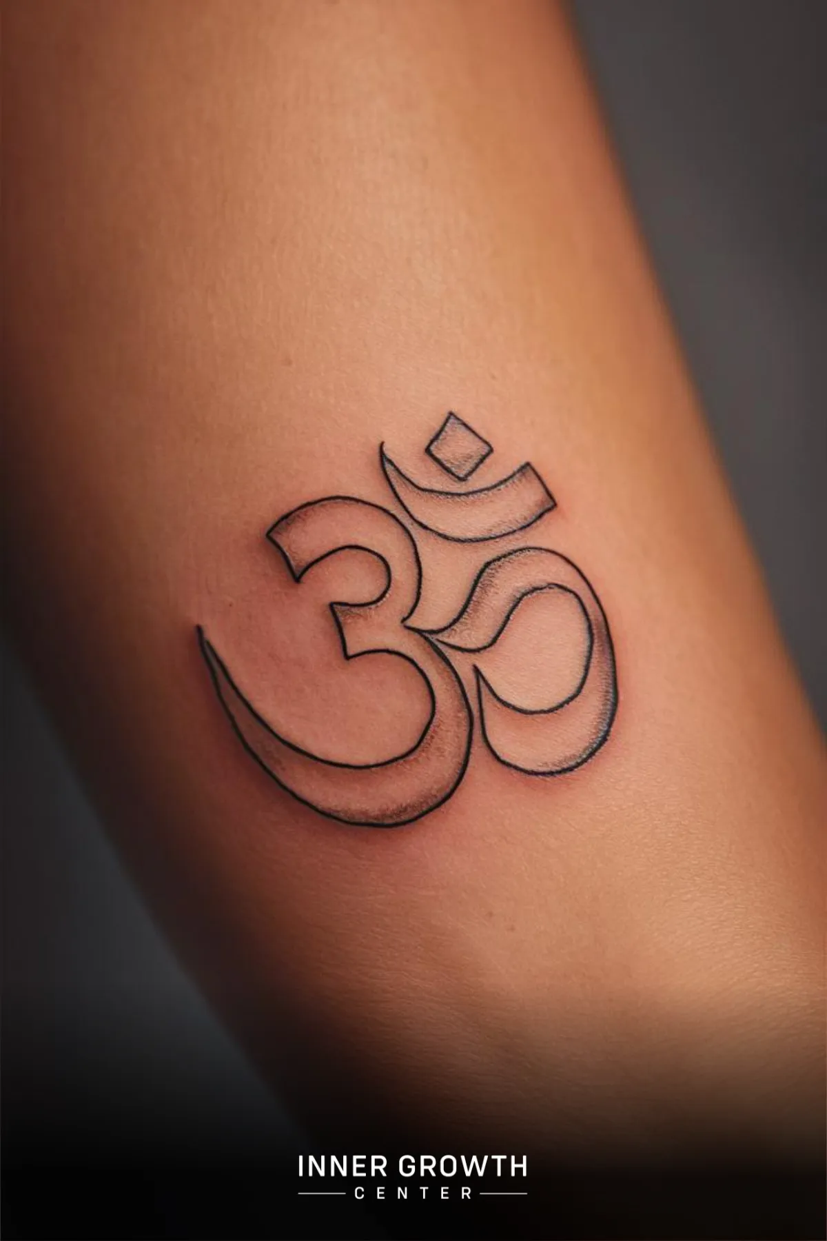 A Om Symbol tattoo.