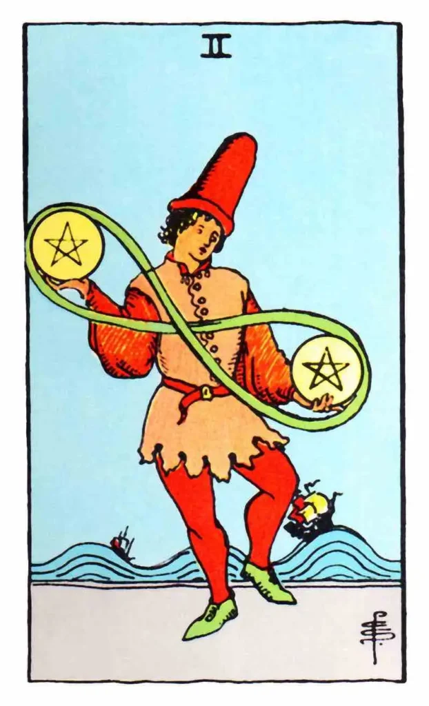 A man holds two pentacles as the two of pentacles tarot card.