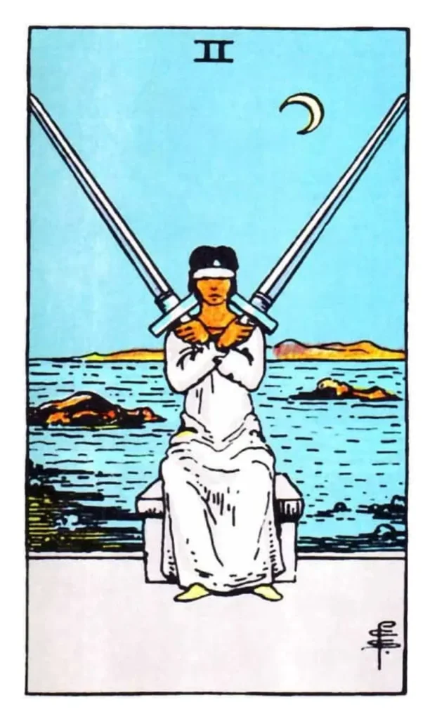 A blind folded person holding two swords as the 2 of swords tarot card.